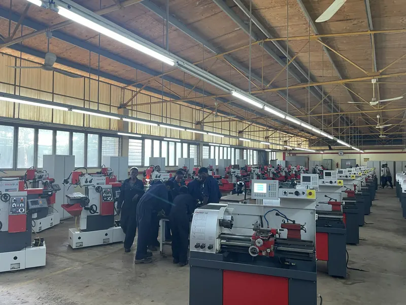 Row of industrial lathe machines in a workshop